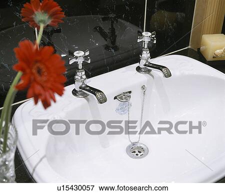 Close-up of white basin with chrome taps View Large Photo Image Stock Photo - Close-up of white basin with chrome taps. Fotosearch
