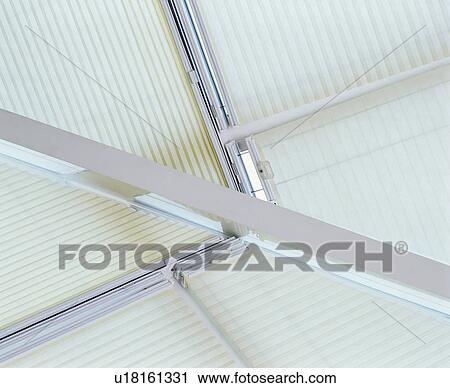 Stock Image - Close-up of white ceiling blinds. Fotosearch
