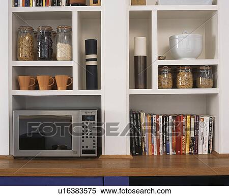 Close-up of white cube shelves with pots and microwave oven View Large Photo Image Stock Photography - Close-up of white cube shelves with pots and microwave oven. Fotosearch