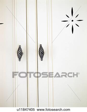 Close-up of white cupboard doors with black metal handles View Large Photo Image Stock Photography - Close-up of white cupboard doors with black metal handles. Fotosearch
