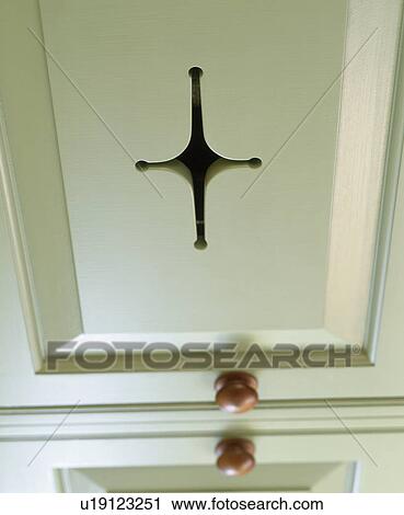 Stock Image - Close-up of white kitchen cupboard. Fotosearch