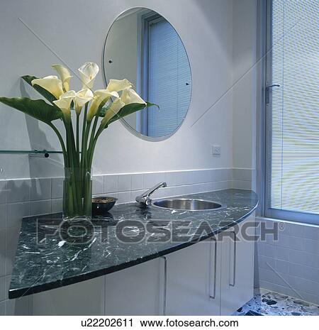 Close-up of white lilies on modern granite vanity unit View Large Photo Image Stock Image - Close-up of white lilies on modern granite vanity unit. Fotosearch