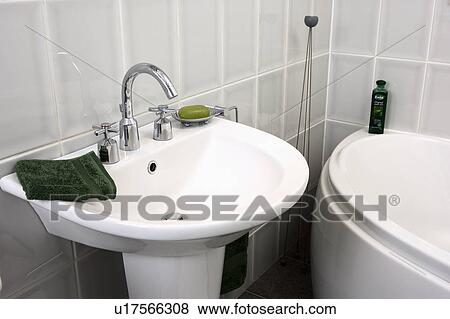 Stock Photo - Close-up of white pedestal basin. Fotosearch