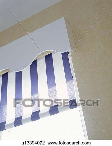 Close up of white pelmet above blue and white striped blind View Large Photo Image Stock Image - Close up of white pelmet above blue and white striped blind. Fotosearch