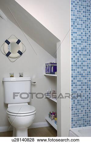 Close-up of white toilet in alcove View Large Photo Image Stock Photo - Close-up of white toilet in alcove. Fotosearch