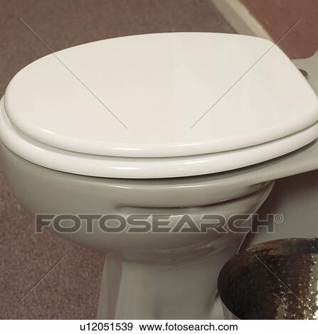 Close-up of white toilet View Large Photo Image Stock Photo - Close-up of white toilet. Fotosearch