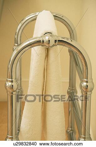 Close-up of white towel on curved metal towel rail View Large Photo Image Stock Image - Close-up of white towel on curved metal towel rail. Fotosearch