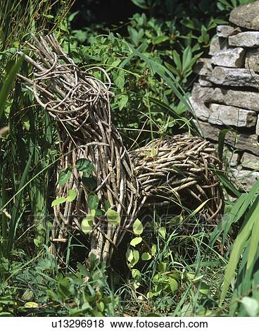 Stock Photo - Close-up of wicker dog statue. Fotosearch
