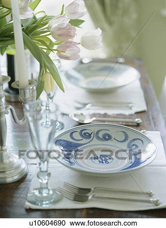 Close-up of wine glasses and crockery on table set for lunch View Large Photo Image Stock Image - Close-up of wine glasses and crockery on table set for lunch. Fotosearch