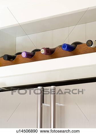 Stock Image - Close-up of wine storage on shelf. Fotosearch