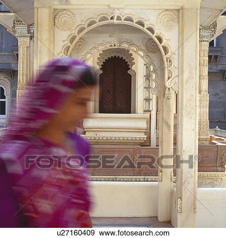 Close-up of woman in red sari at the Udai Bilas Palace in Dungarpur in Rajastan View Large Photo Image Stock Photo - Close-up of woman in red sari at the Udai Bilas Palace in Dungarpur in Rajastan. Fotosearch