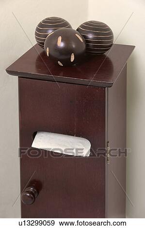 Stock Photo - Close-up of wooden balls on small cupboard. Fotosearch