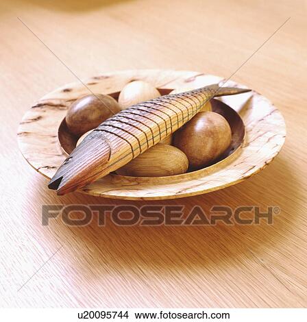 Close-up of wooden fish and eggs on wooden dish View Large Photo Image Picture - Close-up of wooden fish and eggs on wooden dish. Fotosearch