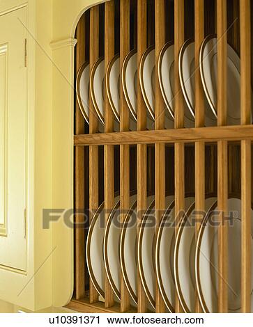 Close-up of wooden plate rack View Large Photo Image Stock Image - Close-up of wooden plate rack. Fotosearch