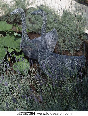 Picture - Close-up of wrought metal statues of geese. Fotosearch