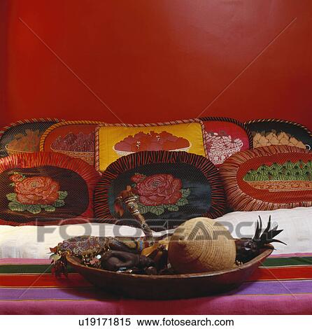 Colourful Cushions On Cream Sofa In Red Middle Eastern Style