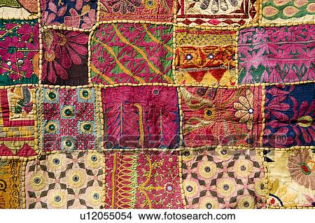 Picture - Colourful patterned embroidered tablecloth for sale in the market, Mattancherry, Cochin, Kerala, India. Fotosearch