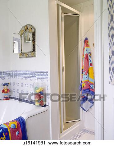 colourful towels and blue+white tiles in family bathroom View Large Photo Image Stock Image - colourful towels and blue+white tiles in family bathroom. Fotosearch