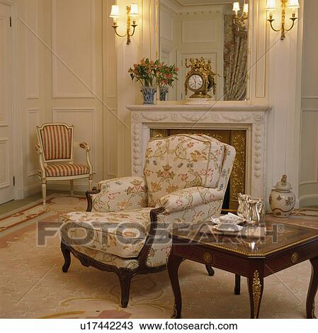 Comfortable armchair in townhouse living room View Large Photo Image Stock Image - Comfortable armchair in townhouse living room . Fotosearch