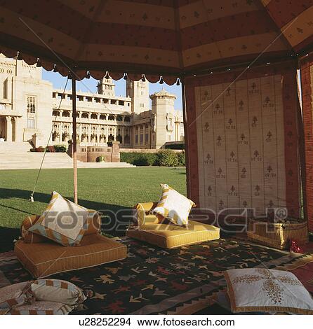Comfortable cushions in luxury tent on the lawn of the Rajvilas Hotel in Rajasthan View Large Photo Image Picture - Comfortable cushions in luxury tent on the lawn of the Rajvilas Hotel in Rajasthan. Fotosearch