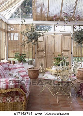 Comfortable sofa in conservatory dining room with split-cane blinds View Large Photo Image Stock Image - Comfortable sofa in conservatory dining room with split-cane blinds. Fotosearch