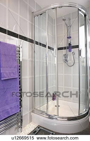 Stock Photography - Corner shower cabinet with glass doors. Fotosearch