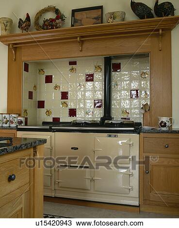 Stock Image - Cream Aga oven in country kitchen. Fotosearch