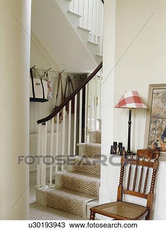 Cream carpet on staircase in small white country hall View Large Photo Image Stock Image - Cream carpet on staircase in small white country hall. Fotosearch