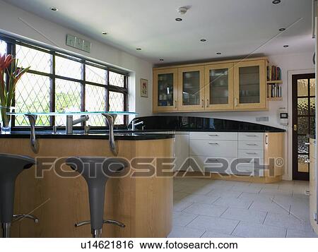 Cream ceramic floor tiles in modern country kitchen View Large Photo Image Stock Photograph - Cream ceramic floor tiles in modern country kitchen. Fotosearch