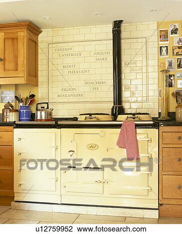Cream double Aga oven below cream tiled wall in country kitchen View Large Photo Image Stock Image - Cream double Aga oven below cream tiled wall in country kitchen. Fotosearch