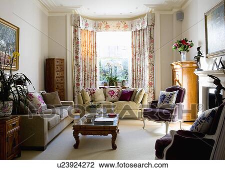 Cream Sofas And Purple Velour French Style Armchairs In