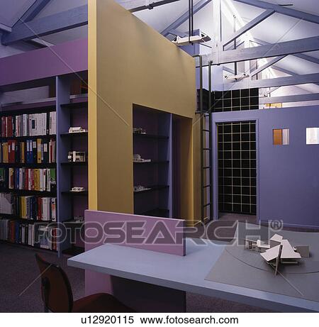 Stock Photography - Cream wall divider in large openplan modern office with shelving. Fotosearch
