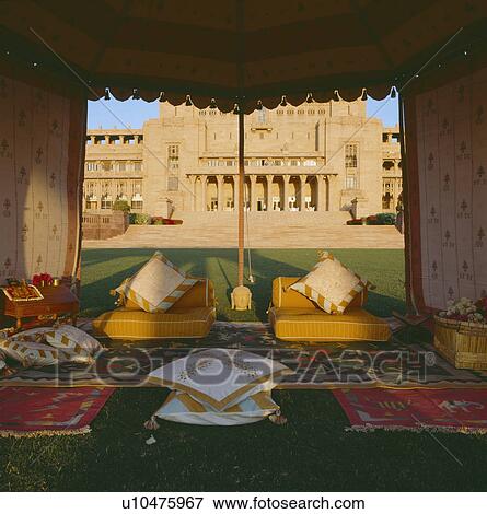 Cushions and rug on floor of traditional Rajastani tent on lawn in front of the Palace of Jodhpur in Rajastan View Large Photo Image Stock Photo - Cushions and rug on floor of traditional Rajastani tent on lawn in front of the Palace of Jodhpur in Rajastan. Fotosearch