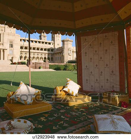 Cushions and rug on floor of traditional Rajastani tent on lawn in front of the Palace of Jodhpur in Rajastan View Large Photo Image Stock Photo - Cushions and rug on floor of traditional Rajastani tent on lawn in front of the Palace of Jodhpur in Rajastan. Fotosearch