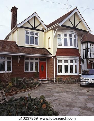 Stock Photo - Detached thirties house with bay windows. Fotosearch