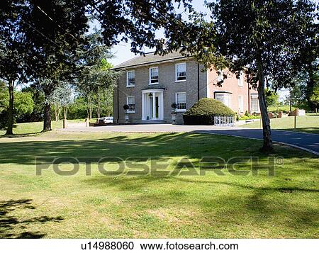 Detached Victorian country house in garden with large lawn and trees View Large Photo Image Stock Image - Detached Victorian country house in garden with large lawn and trees. Fotosearch