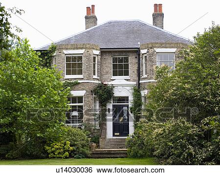 Stock Photograph - Detached Victorian country house with bay windows. Fotosearch