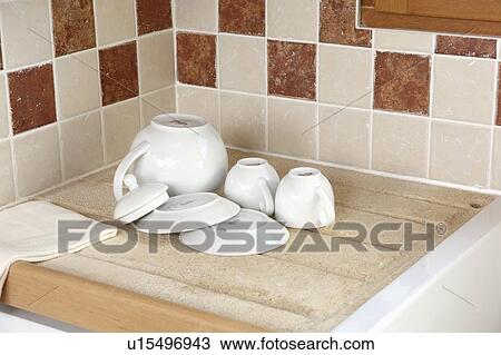 Detail of modern kitchen in stone building with neutral coloured materials and beamed ceiling. View Large Photo Image Stock Image - Detail of modern kitchen in stone building with neutral coloured materials and beamed ceiling.. Fotosearch