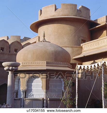 Stock Photography - Dome and turret on old sandstone fort now the Rajvilas Hotel near Jaipur in Rajastan. Fotosearch