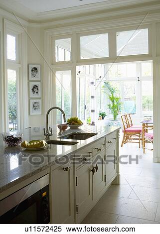 Double sinks in island unit in cream kitchen View Large Photo Image Stock Photography - Double sinks in island unit in cream kitchen. Fotosearch