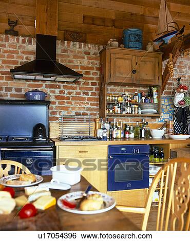 Exposed brick wall above oven in traditional country kitchen View Large Photo Image Stock Photograph - Exposed brick wall above oven in traditional country kitchen. Fotosearch
