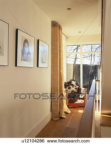 Faux fur upholstered armchair in narrow modern hall with wooden floor View Large Photo Image Stock Photograph - Faux fur upholstered armchair in narrow modern hall with wooden floor. Fotosearch