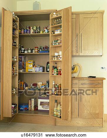Fitted larder cupboard with doors open View Large Photo Image Stock Image - Fitted larder cupboard with doors open. Fotosearch