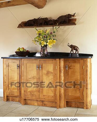 Stock Photography - Fitted pippy-oak unit in country kitchen. Fotosearch