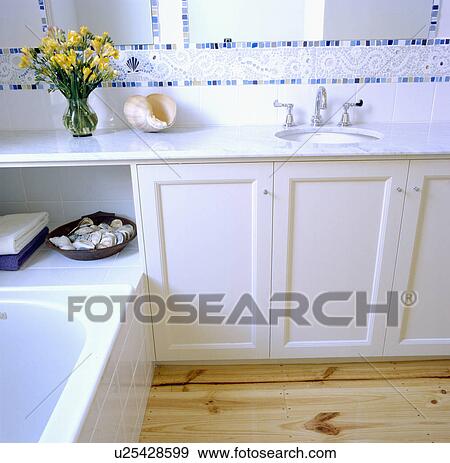 Fitted vanity unit in white bathroom View Large Photo Image Stock Photo - Fitted vanity unit in white bathroom. Fotosearch