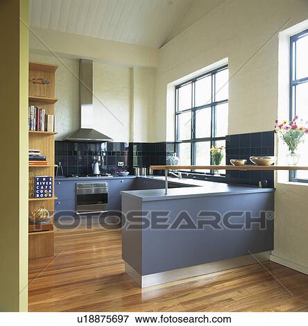 Fittted blue units in modern white kitchen View Large Photo Image Stock Photo - Fittted blue units in modern white kitchen. Fotosearch