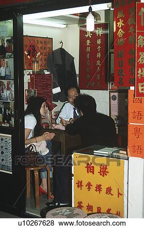 Fortune teller and clients, Wong Tai Sin Temple, Kowloon, Hong Kong View Large Photo Image Stock Photo - Fortune teller and clients, Wong Tai Sin Temple, Kowloon, Hong Kong. Fotosearch