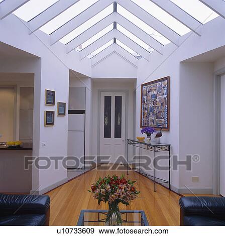 Stock Photo - Glass apex roof in modern white hall. Fotosearch