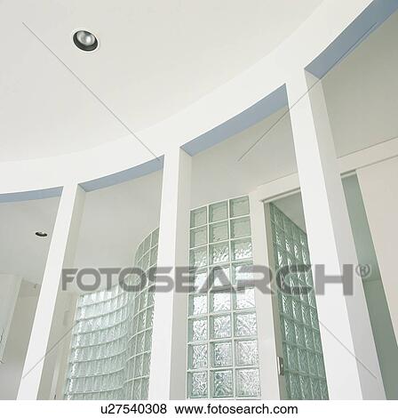 Stock Photo - Glass brick wall in modern white hall. Fotosearch