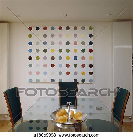 Glass-topped table in modern dining room with abstract picture View Large Photo Image Stock Photo - Glass-topped table in modern dining room with abstract picture. Fotosearch